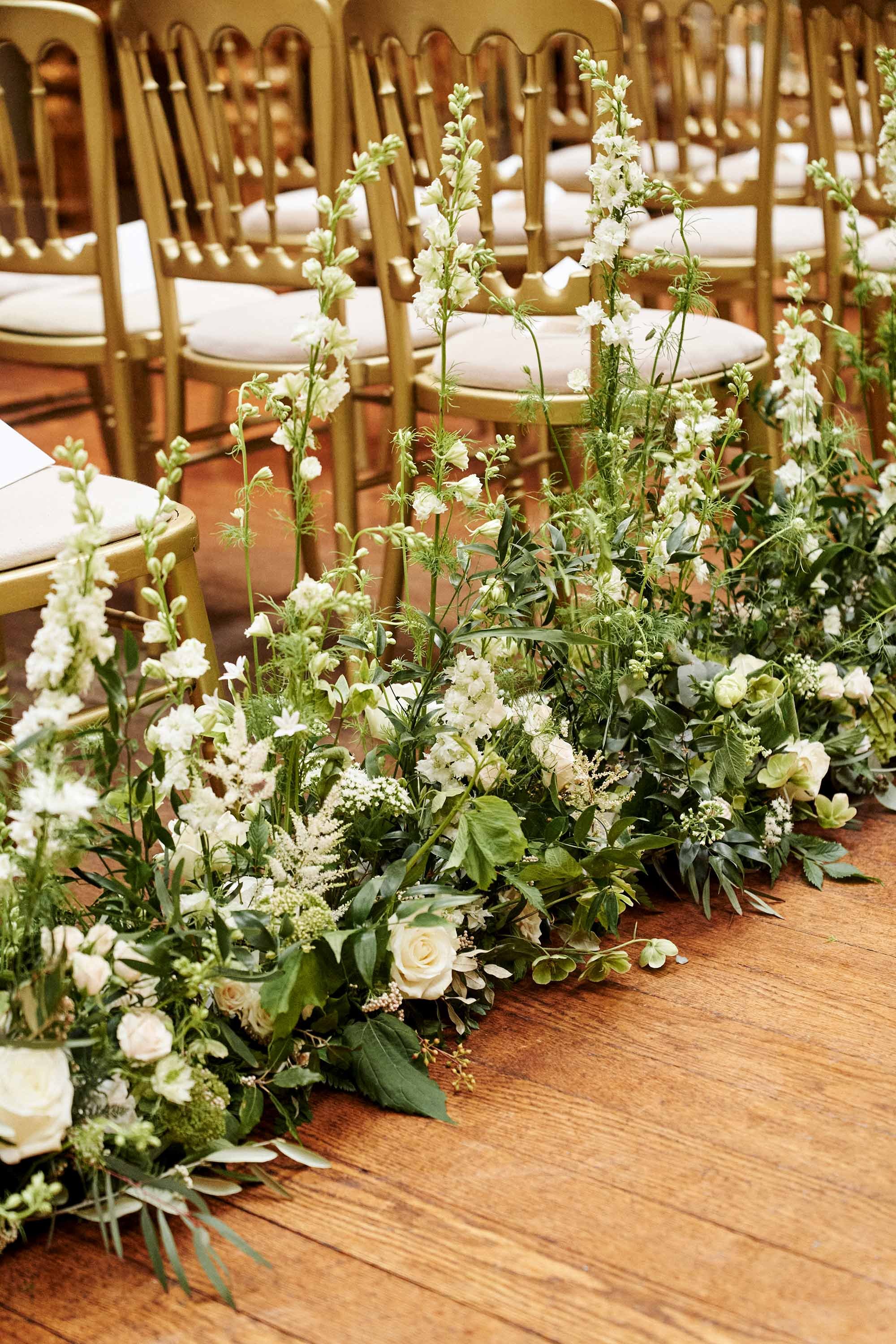 cream and green wedding aisle flowers