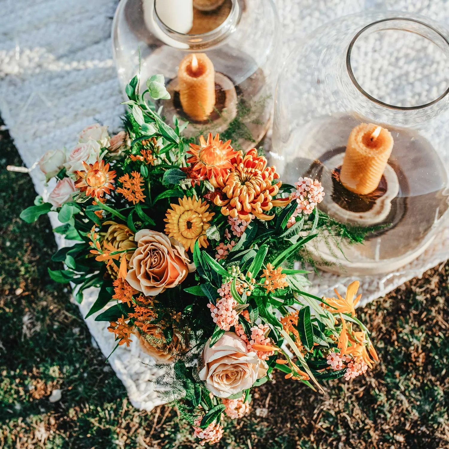 Summer proposal set-up with elegant floral arrangements and candlelight
