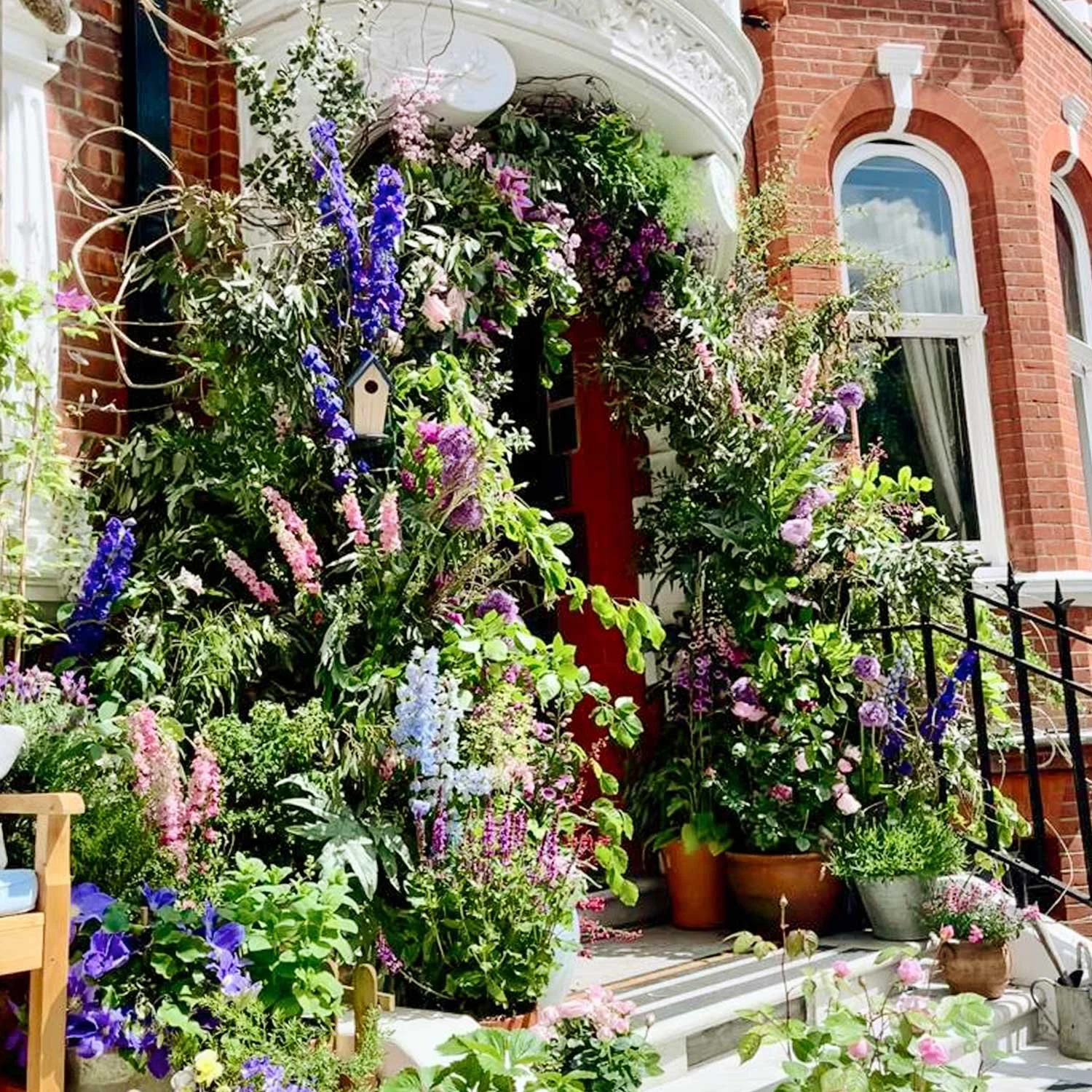 Luxury hotel entrance decorated with floral arch and oversized carrots
