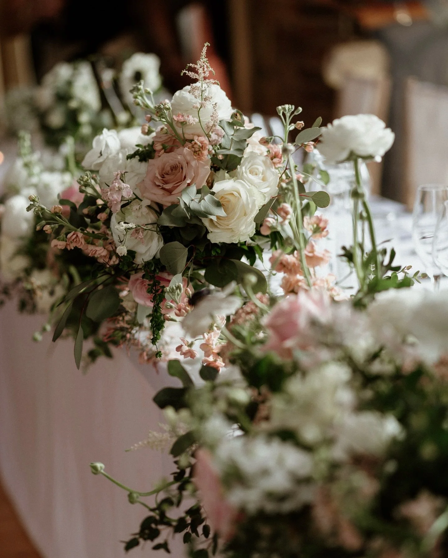 Spring wedding reception flowers at Lulworth Castle in soft pink and crisp ivory with grasses for softness and texture 🌸 🤍 🌾 If you&rsquo;re planning a spring wedding next year, save for inspiration and head to the link in Stories today to book a 