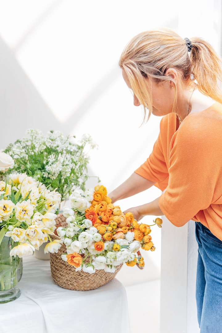 A florist arranges a beautiful bouquet of fresh flowers.