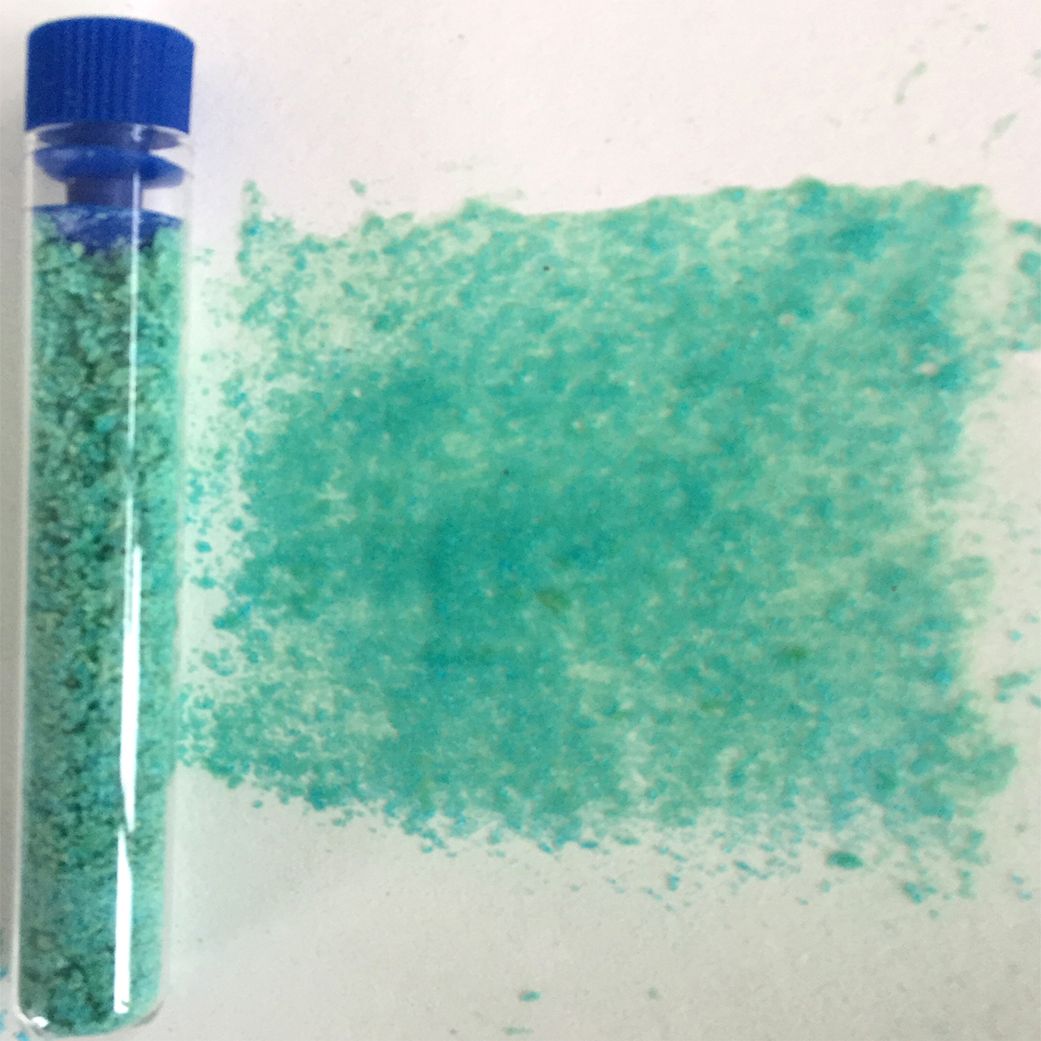 Sample of pigment in bottle and record on paper