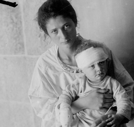 A Jewish mother holds her injured child after the Hebron Massacre of August 23-26, 1929. (Credit: Unknown)