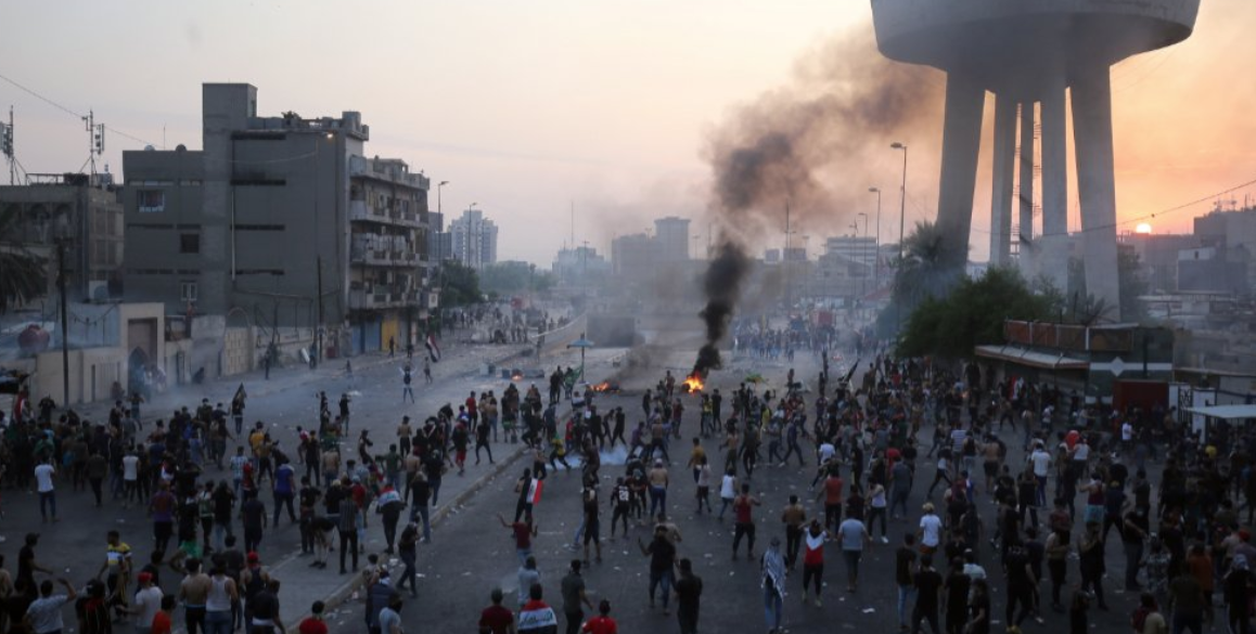 Demonstrators take to the streets in Iraq (Credit: Ahmad al-Rubaye, AFP).