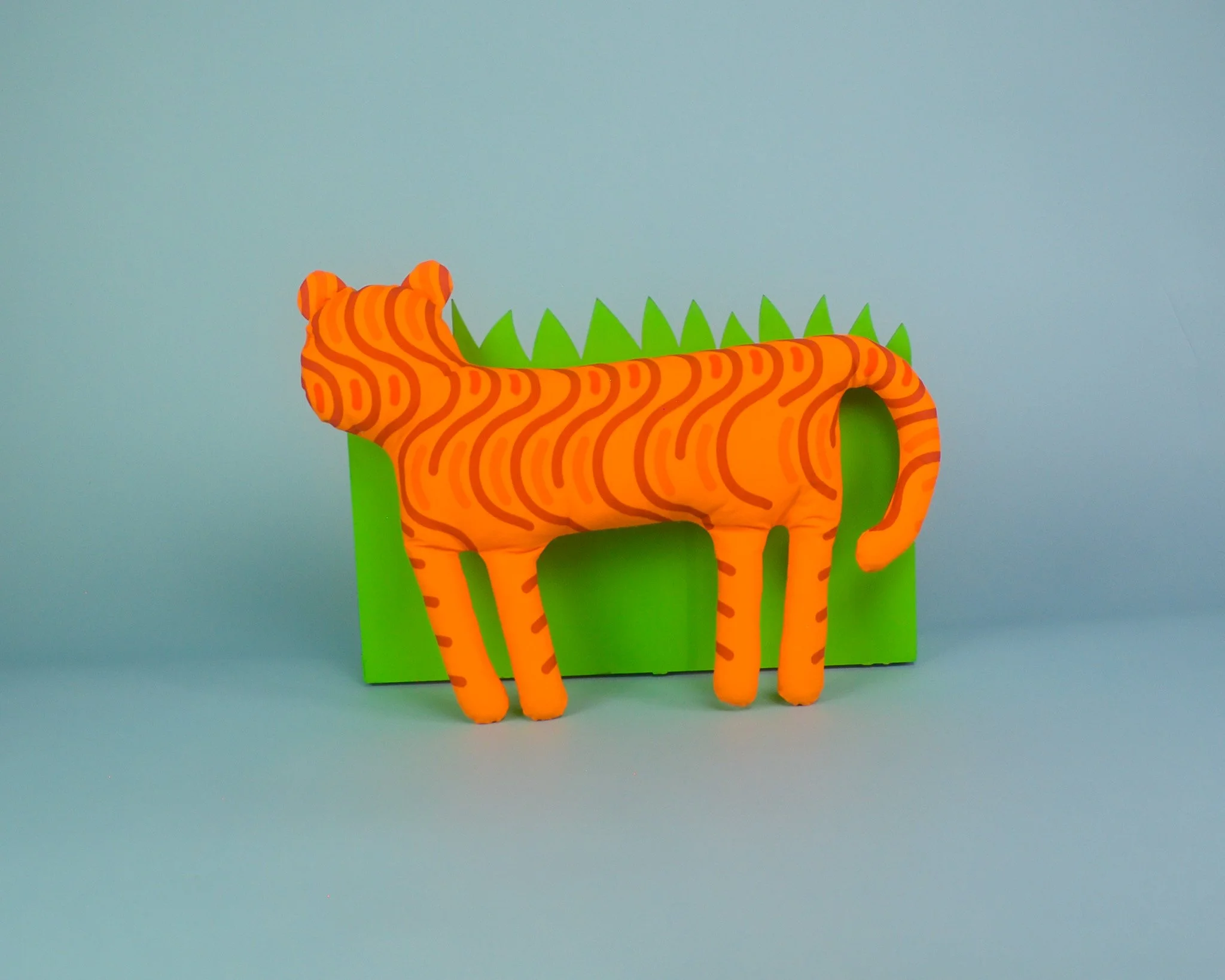 orange-tiny-tiger-back-grass.jpg