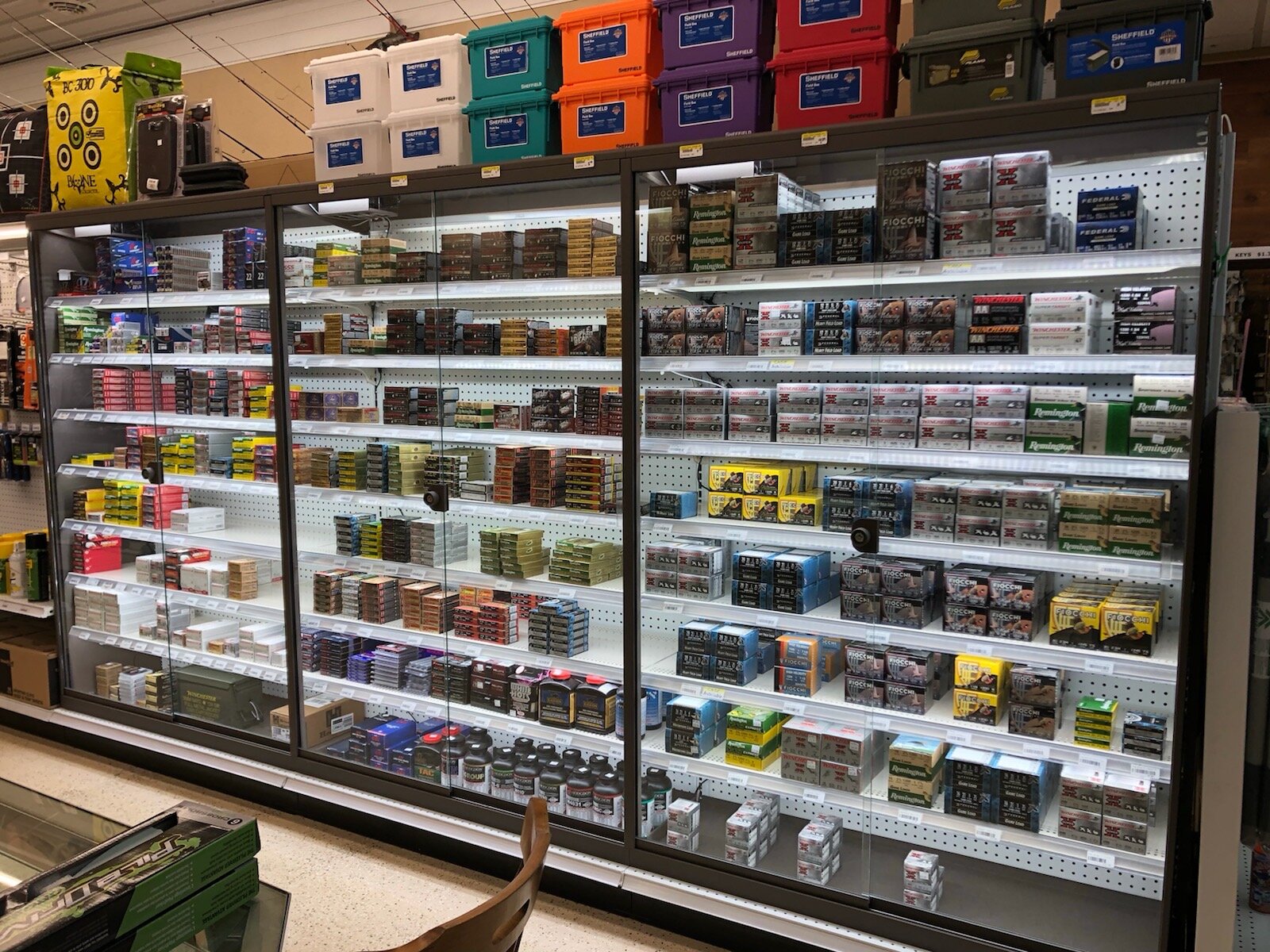  Heavy Duty ammunition shelves with merchandise and undershelf lighting in store 