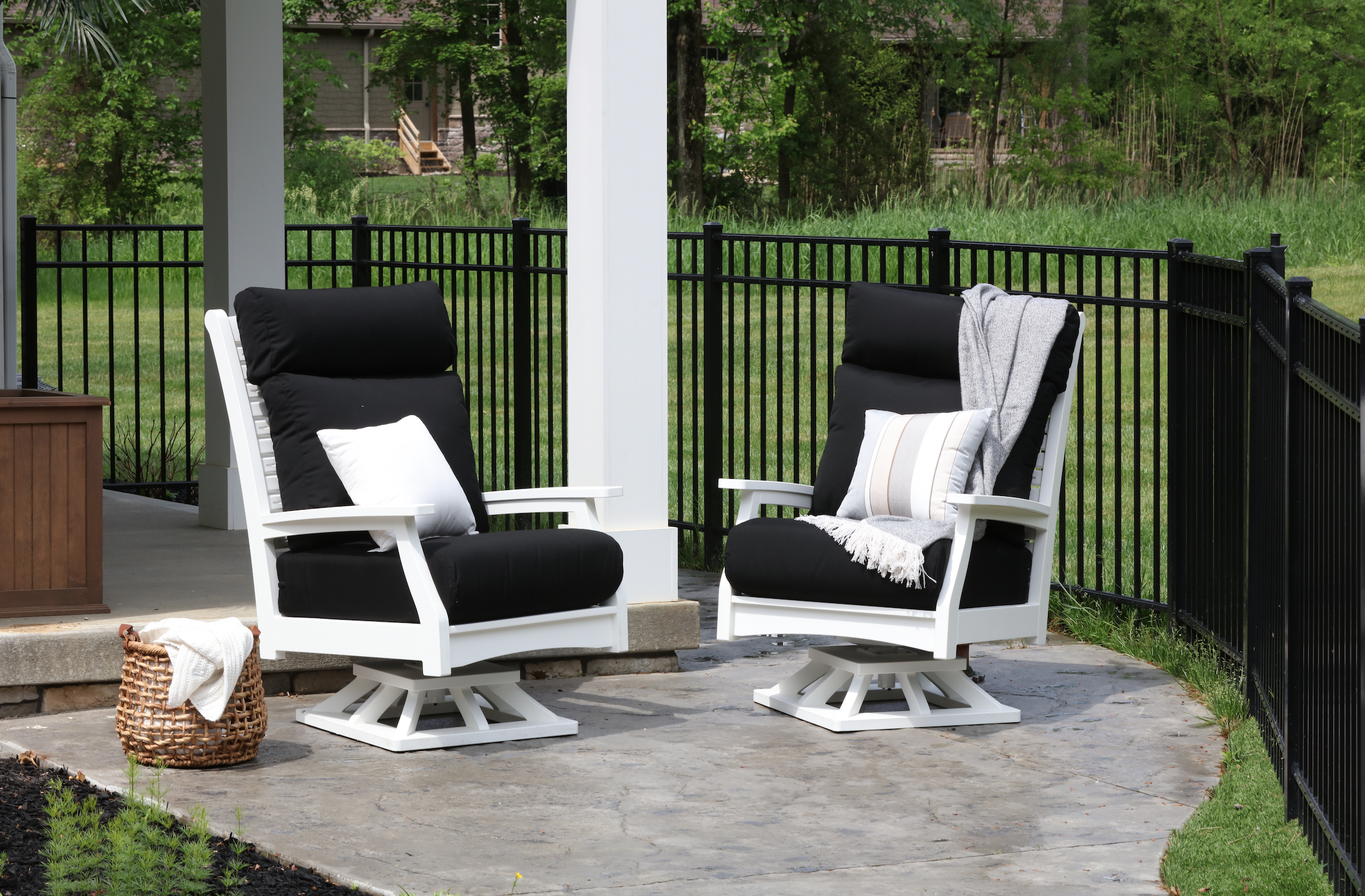  Classic Terrace High Back Swivel Rockers in White. Cushions in Canvas Black. Pillows in Expand Dove and Canvas Natural 