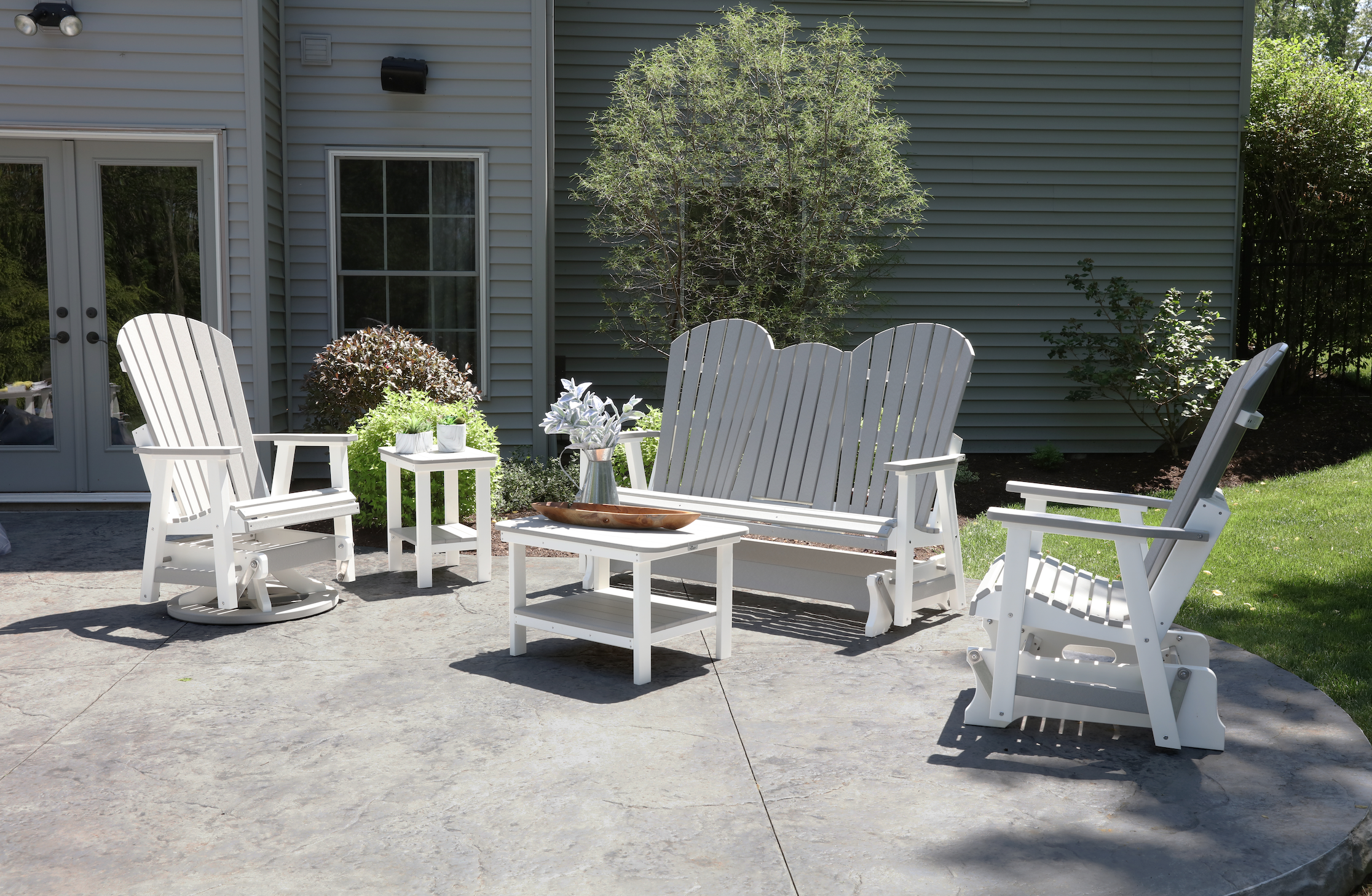  Comfo back three seat glider with console, single glider, swivel glider, rectangular end table and rectangular coffee table in light gray on white. 