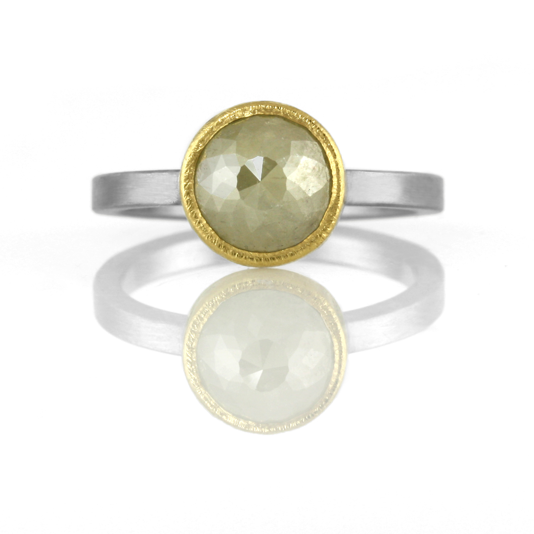 22kt gold bezel setting on stainless steel band