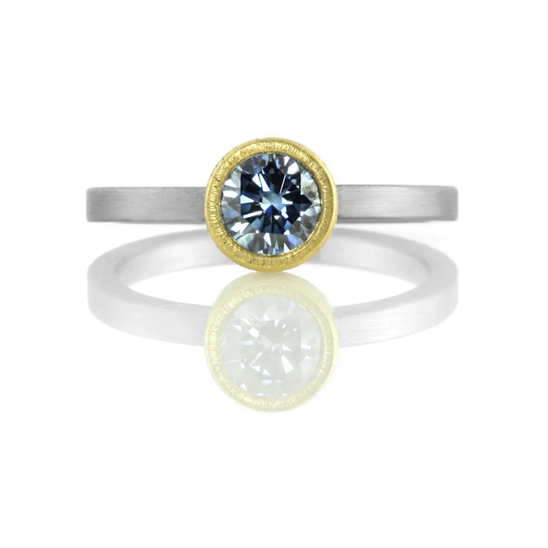 22kt gold bezel setting on stainless steel band