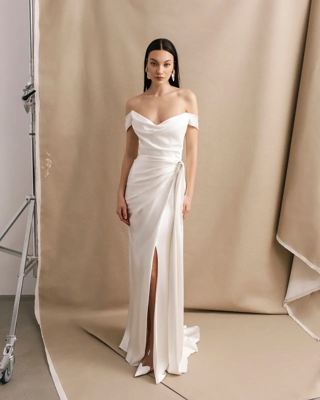 Fluid silk satin draped over a custom made corset.
The draped skirt with split adds movement whilst keeping a fitted silhouette. 
100% Silk satin inside and out. 

'Danielle' from our Divine Atelier collection