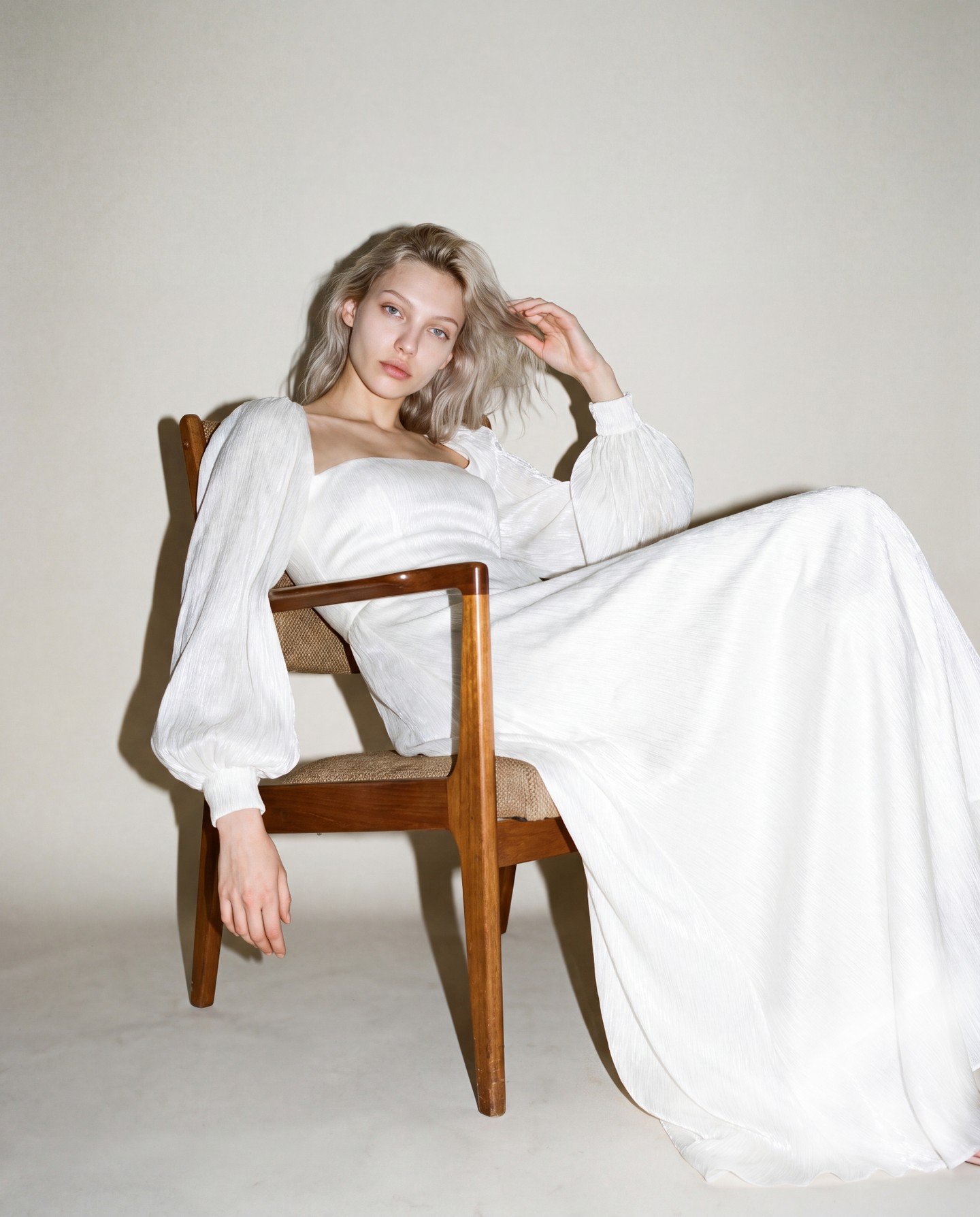 Soft, flowing micro pleated satin column gown with a built in corset, modest train and removable sleeves...

Yulia wears 2754 from Jesus Peiro, Hand crafted in Spain and now available to try in the boutique.