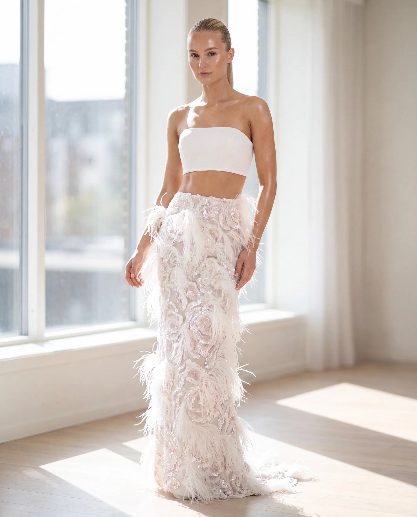 Playful and rich embroidery with ostrich feathers and soft toned sequins on a light tulle base, combined with a crisp, clean crop top with structural boning. 

NF157 from the SS27 Nicole + Felicia collection. 

It&rsquo;s truly stunning and now avail