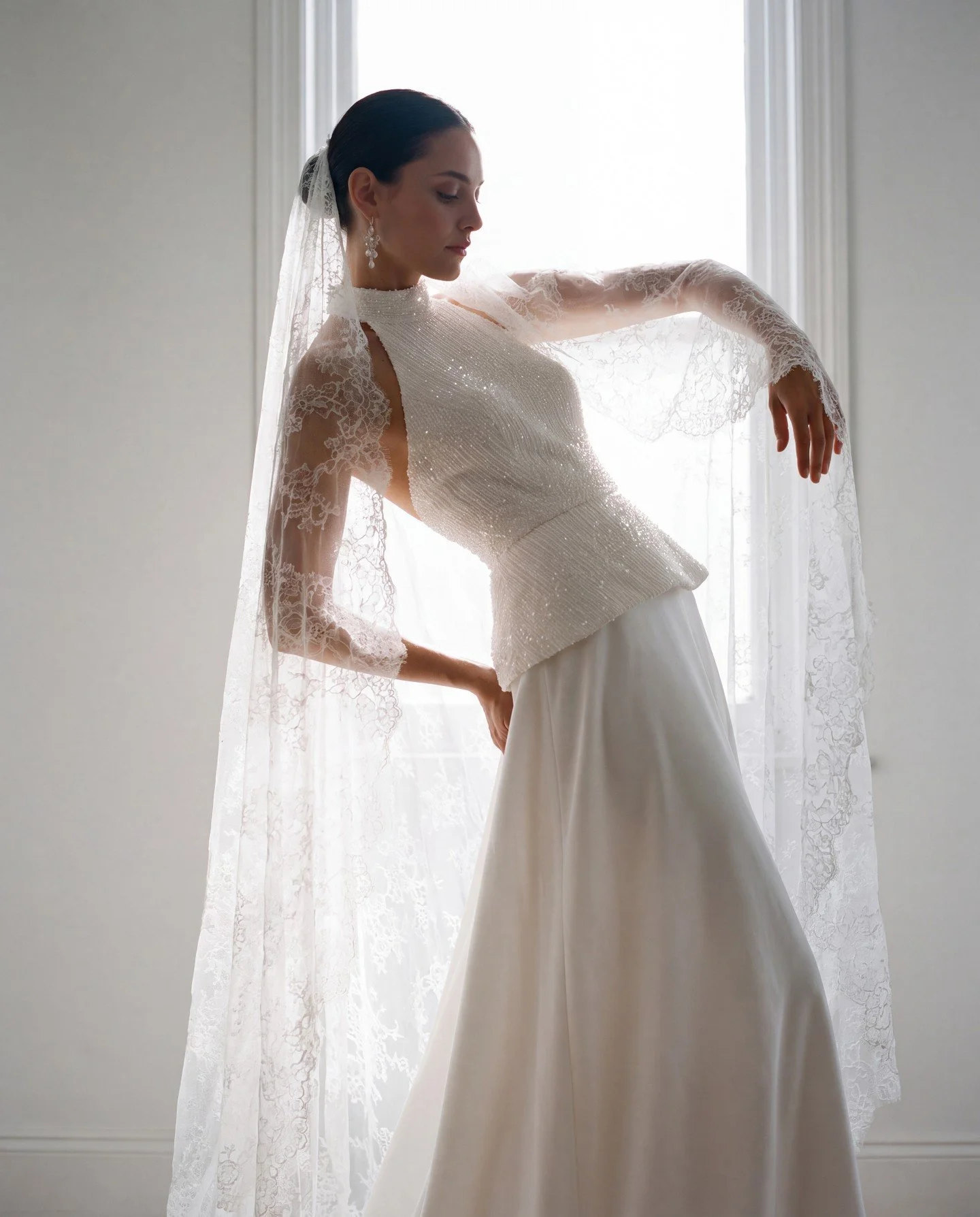 Stunning halter neck top and skirt combination, with a jewelled embroidery on the top with open back and hip skimming peplum. 
The satin skirt flows into a soft, dramatic train.

Style number 2763 from the collection Ovalo by Jesus Peiro now availabl