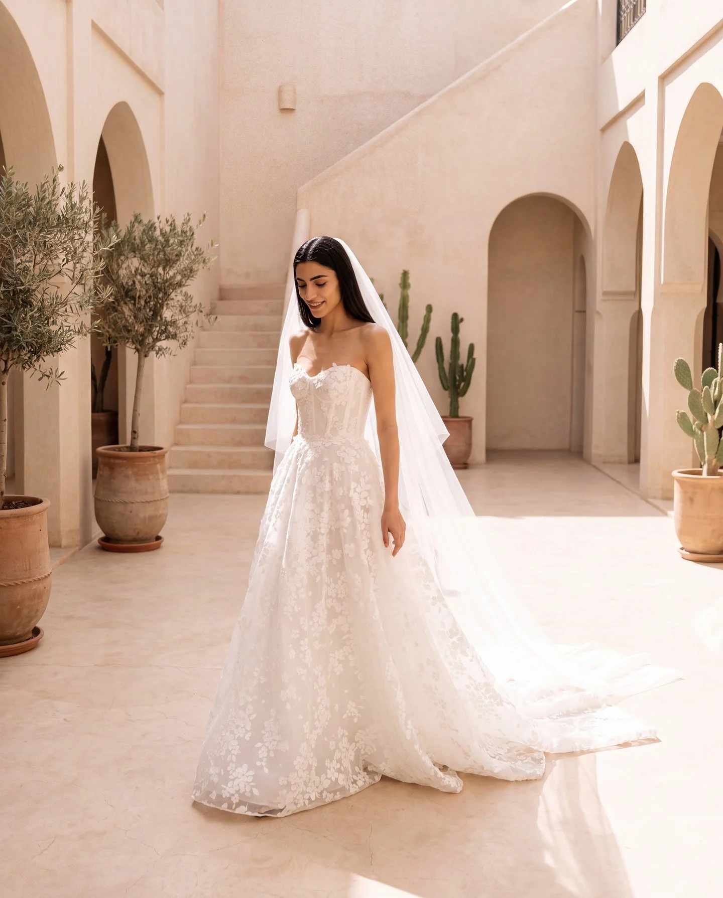 Shining in the Marrakech sun. 

Alev wears our 'Magnolia' gown from from our Atelier collection, with the matching floral veil.