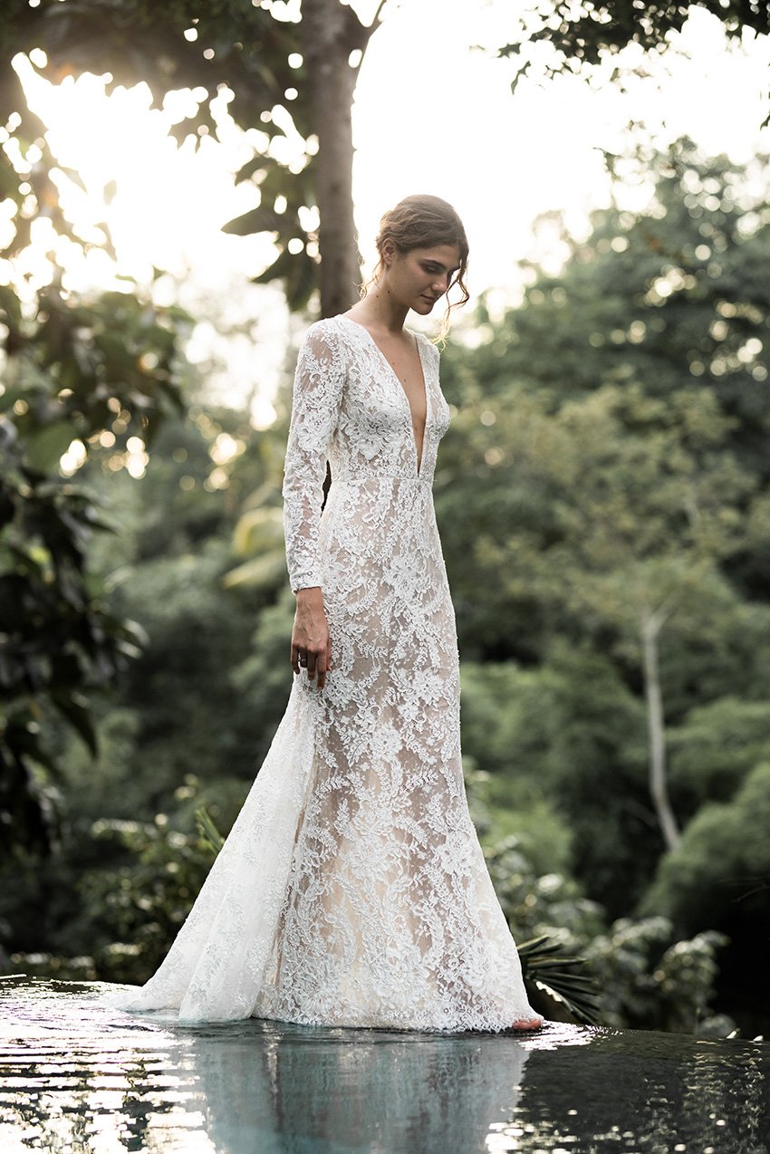 Woman wearing full lace wedding dress with long sleeves "Harper" by Edwin Oudshoorn