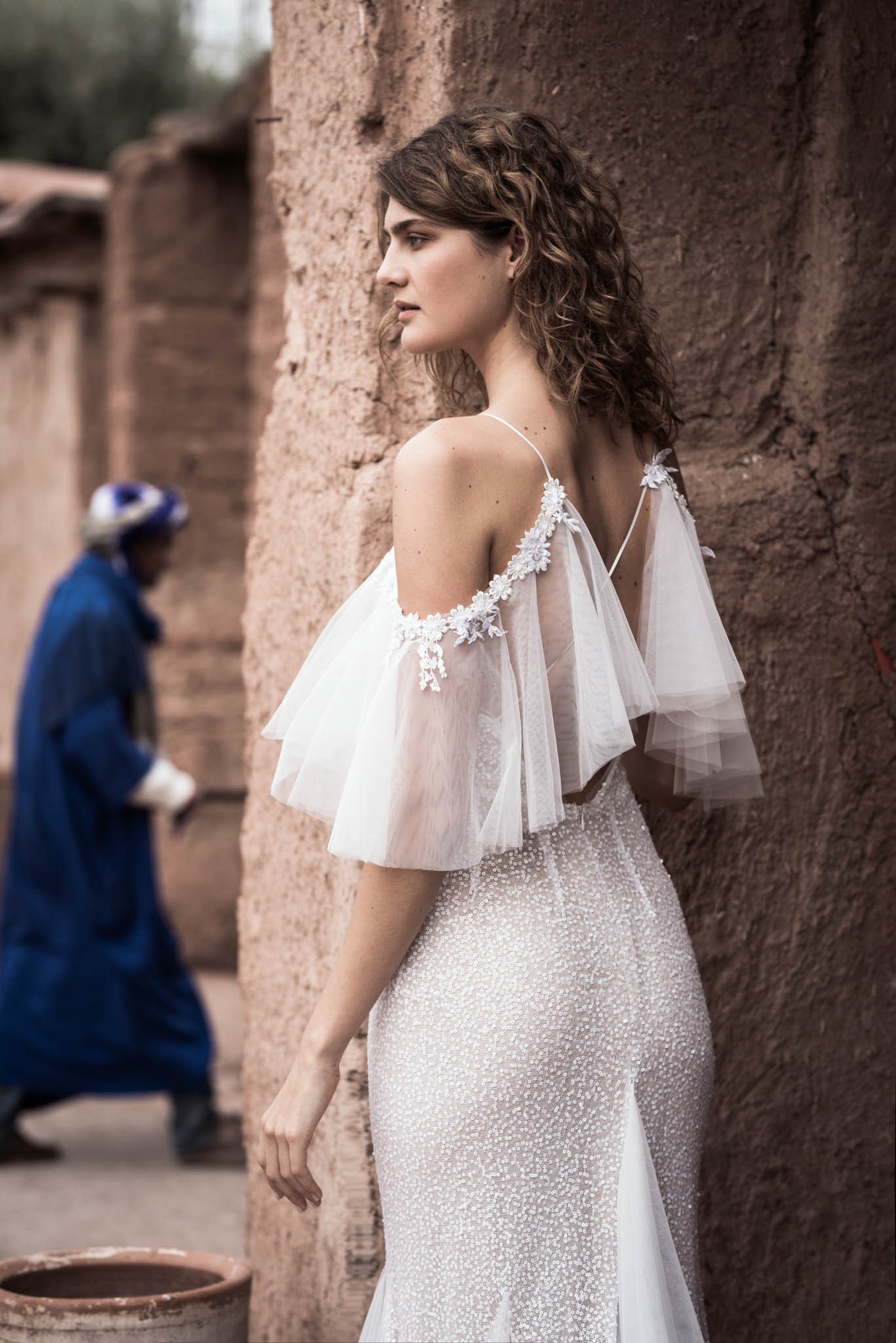 Bride wearing a fit and flare wedding dress full with sequins and tulle by Atelier Edwin Oudshoorn