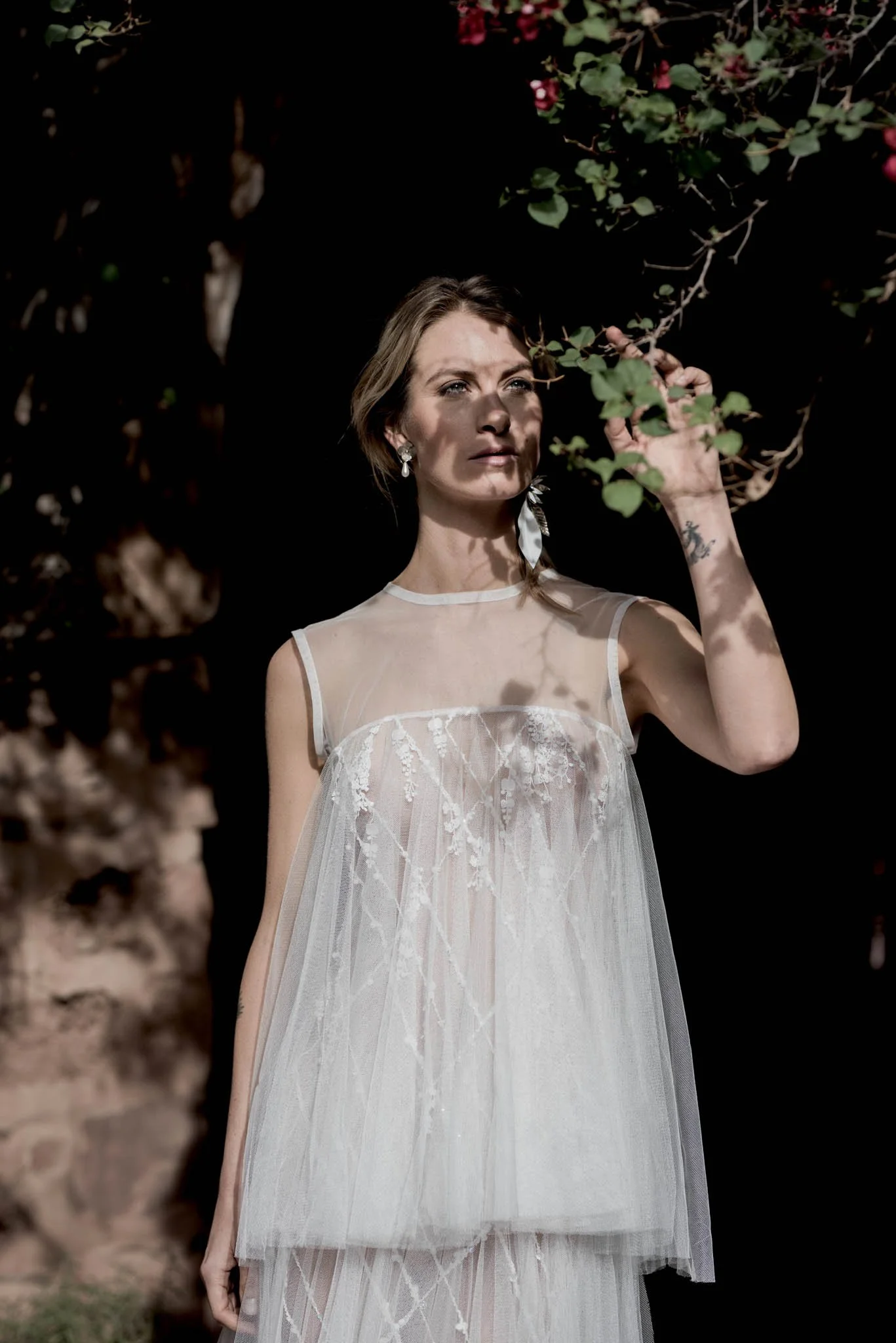 Bride wearing dramatic layered tulle wedding dress with beading and lace "Faye"  by Atelier Edwin Oudshoorn
