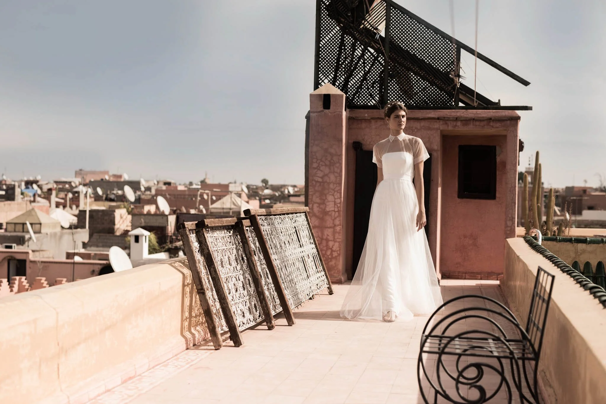 Bride wears a crepe column dress with a tulle overdress with short sleeves "Kirby" by Atelier Edwin Oudshoorn