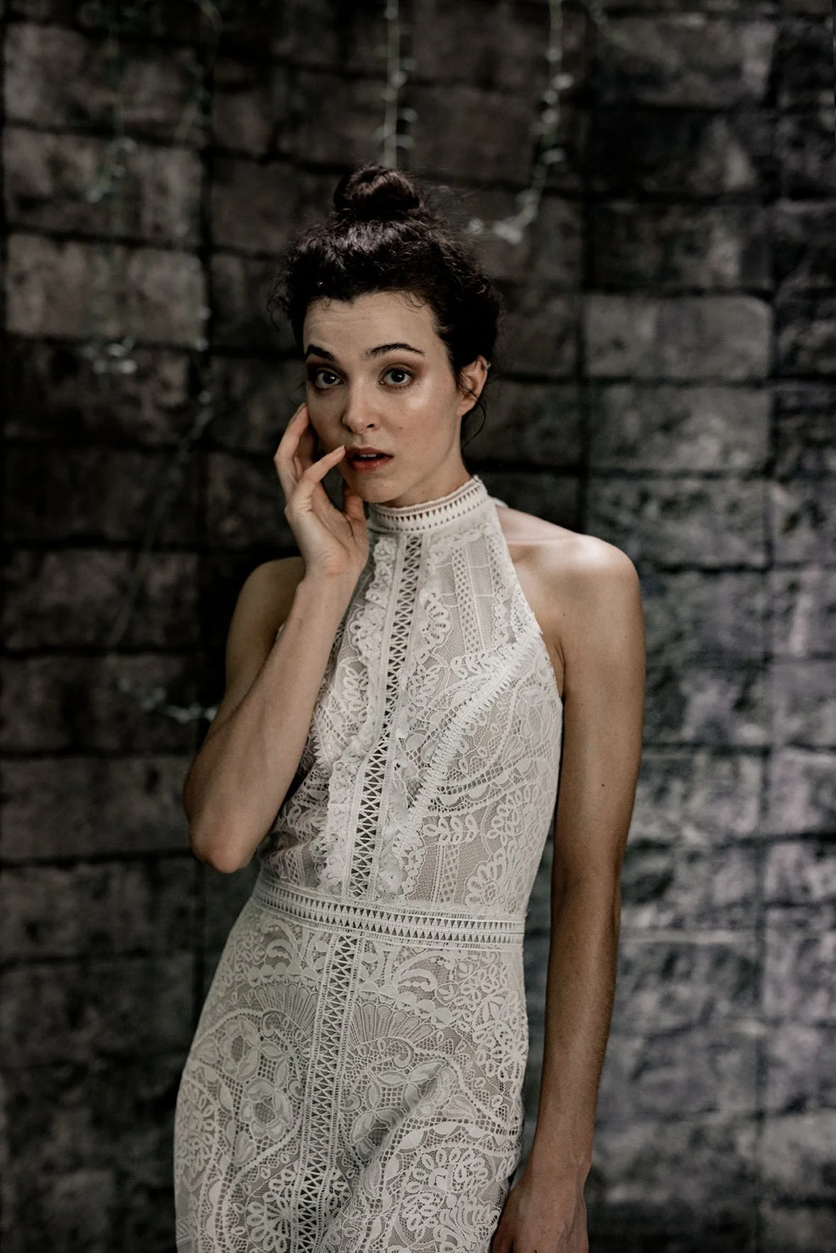 Woman wearing a lace fishtail wedding gown with halter neckline "Willow" by Atelier Edwin Oudshoorn