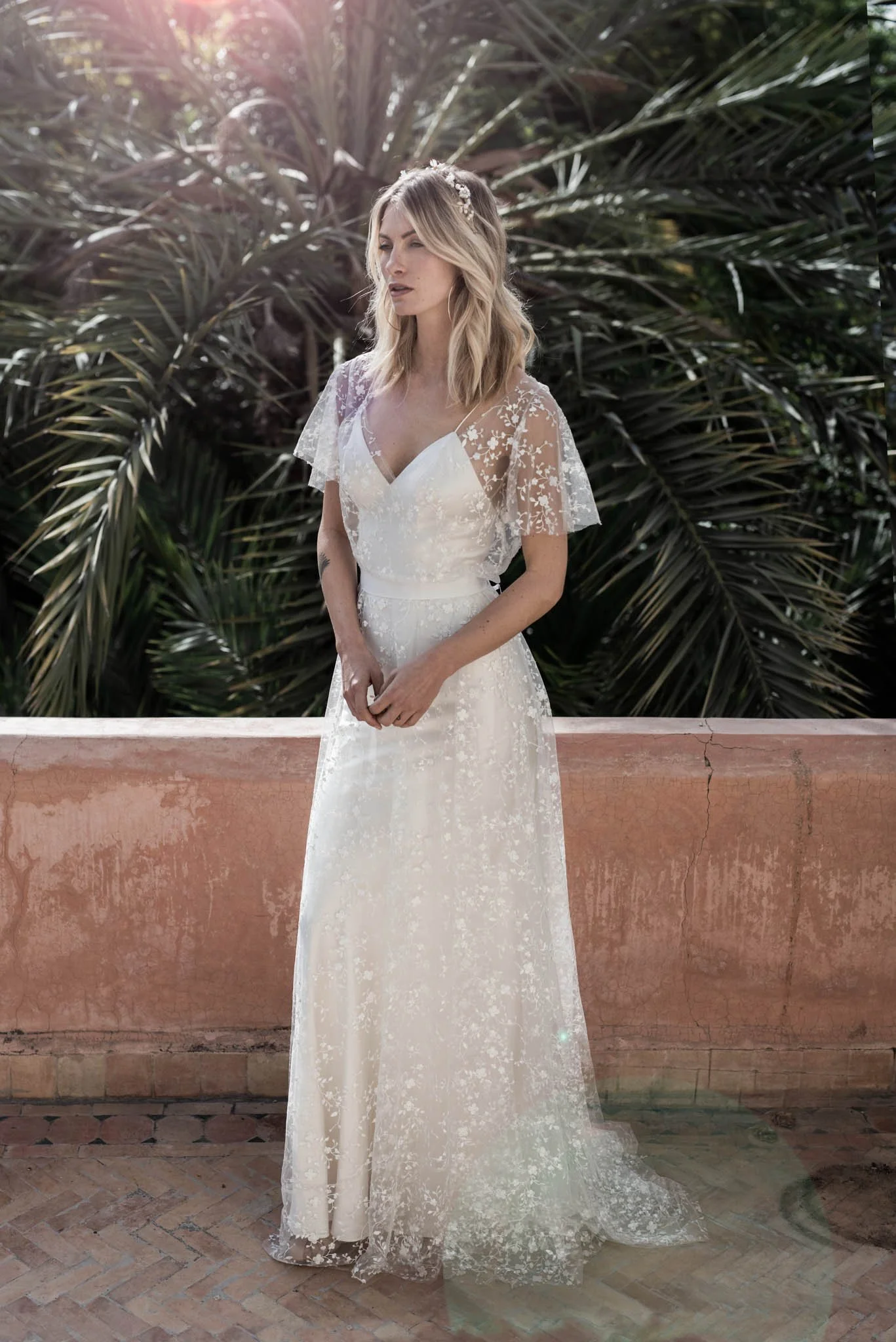 Model wearing the "Lily" tulle and crepe wedding dress from Atelier Edwin Oudshoorn