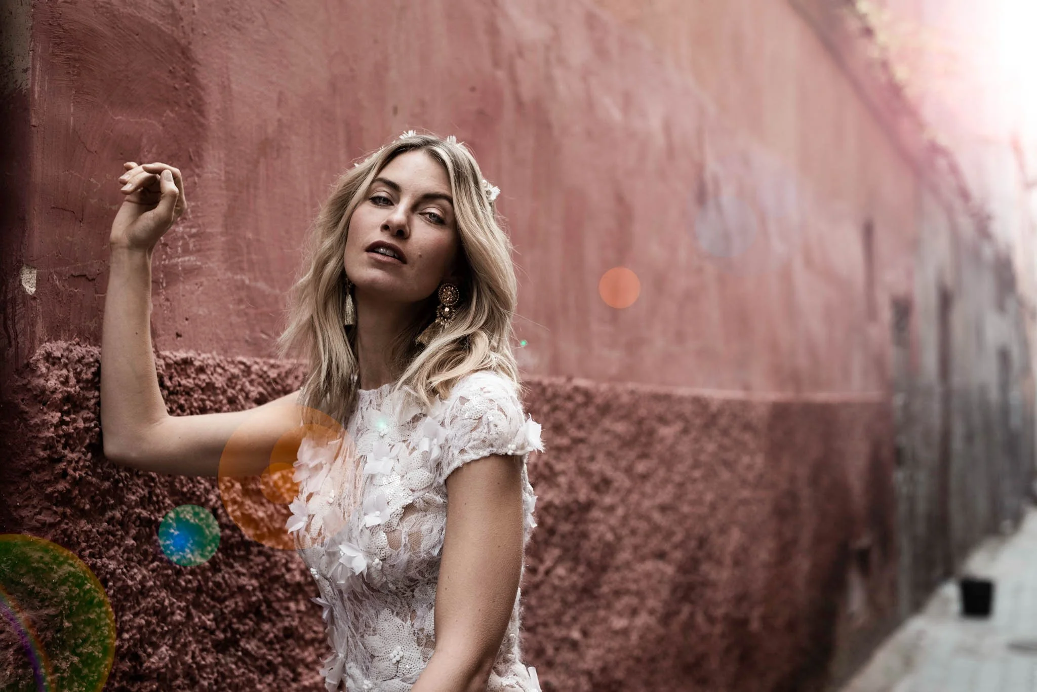 Bride wears delicate silk wedding dress with hand embroidered lace details "Lotte" by Atelier Edwin Oudshoorn