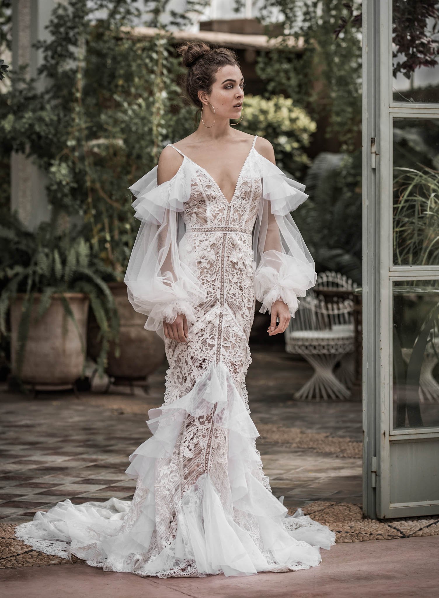 Bride wearing french lace and silk organza fit and flare  wedding gown from  "Ivy" from Atelier Edwin Oudshoorn