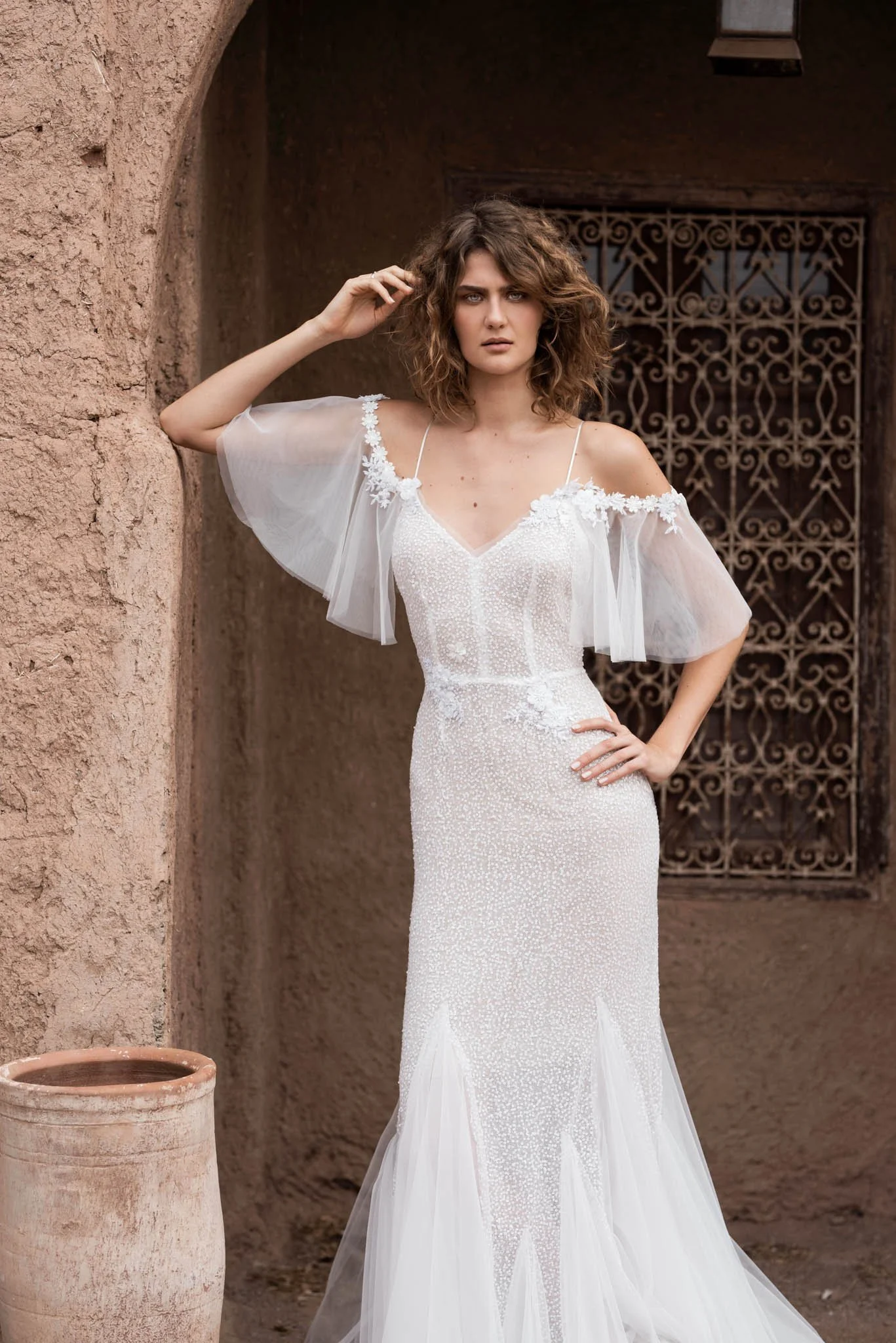 Bride wearing a fit and flare wedding dress full with sequins and tulle by Atelier Edwin Oudshoorn