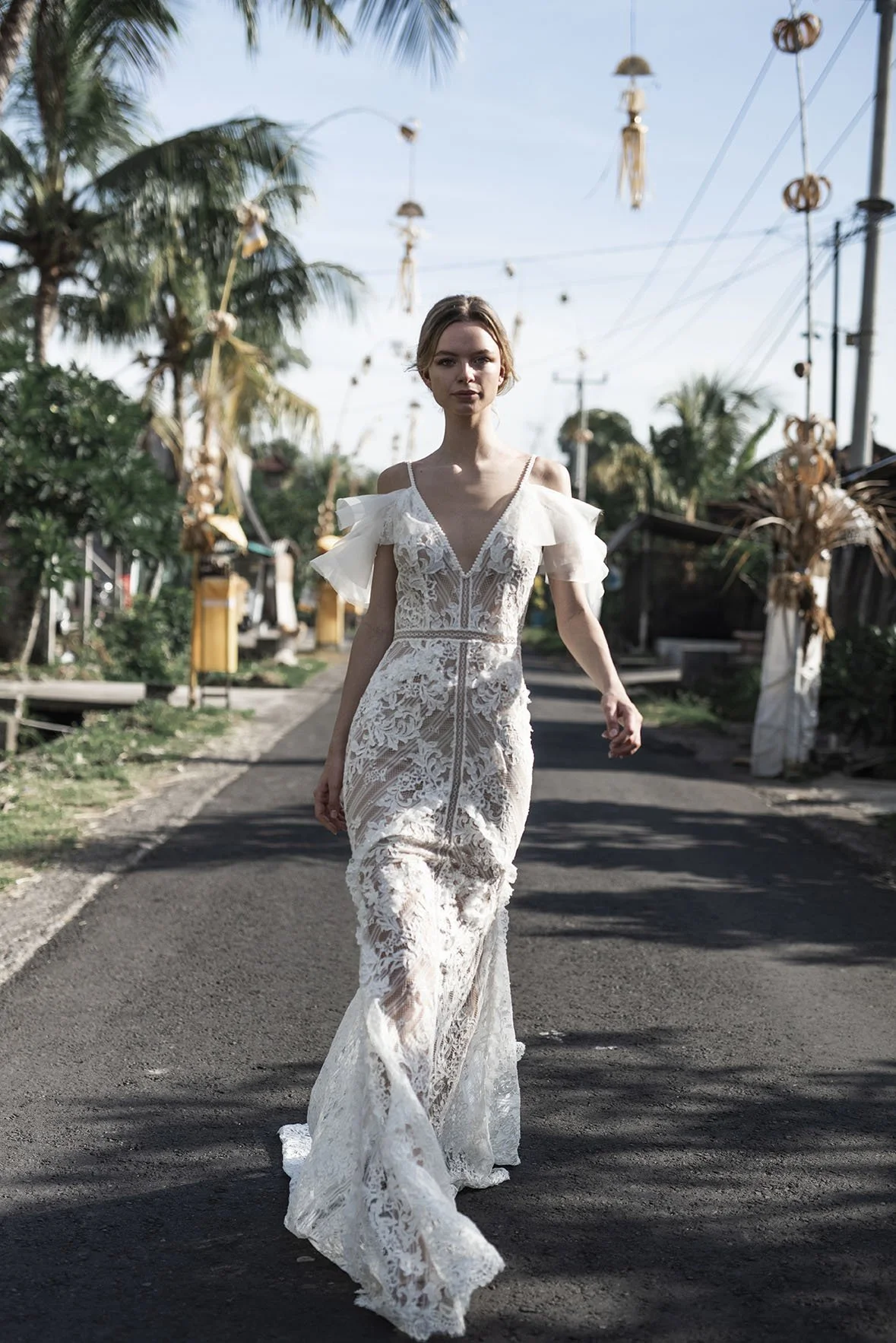 Woman wearing a full lace fit and flare wedding dress "Mia" by Atelier Edwin Oudshoorn