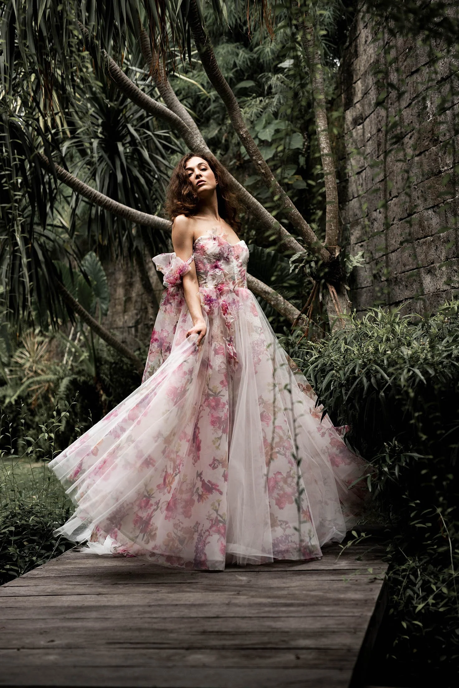 Woman with brown hair wears a pink floral wedding dress  "Rose" by Ateiier Edwin Oudshoorn