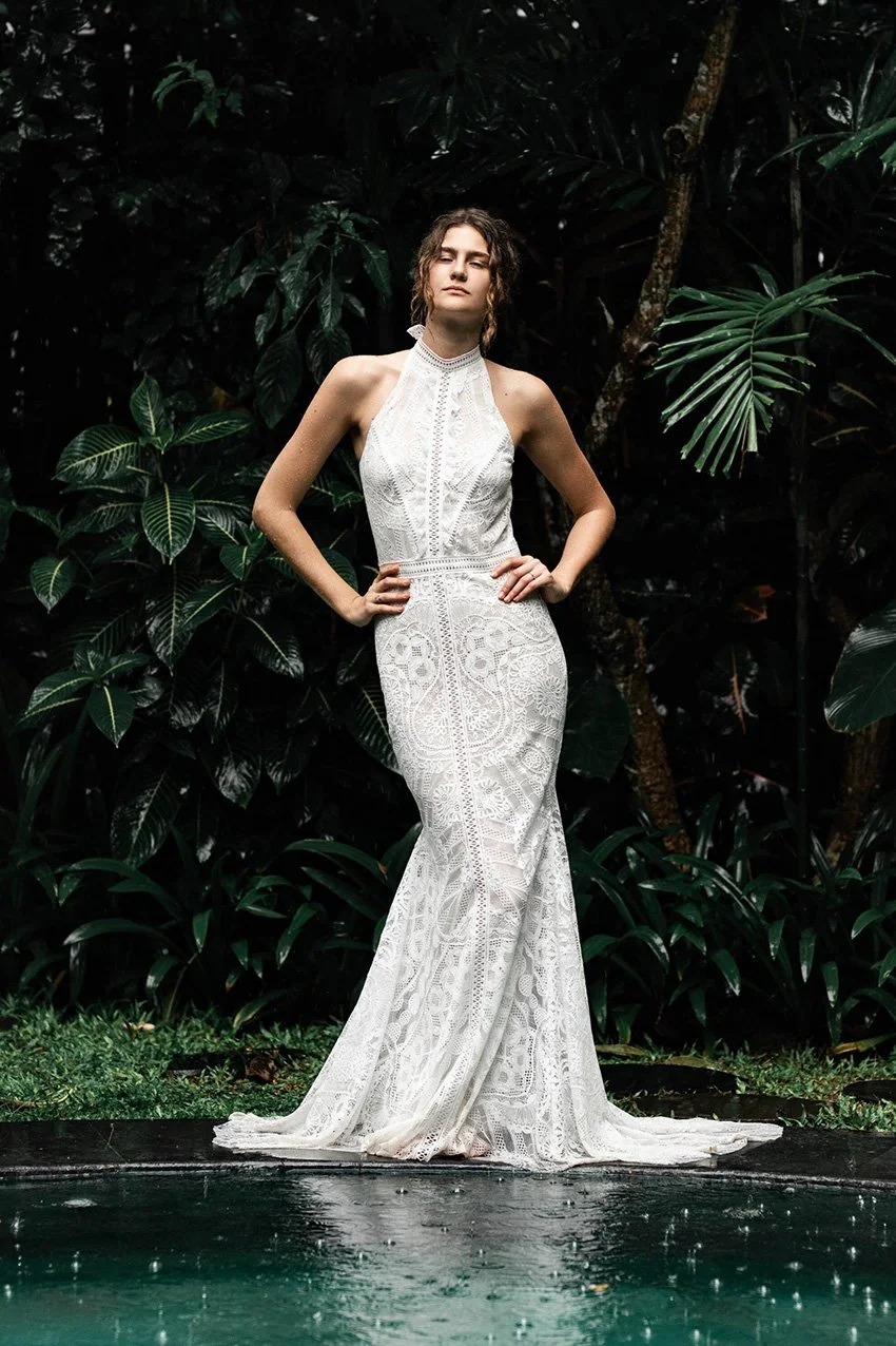 Woman wearing a lace fishtail wedding gown with halter neckline "Willow" by Atelier Edwin Oudshoorn