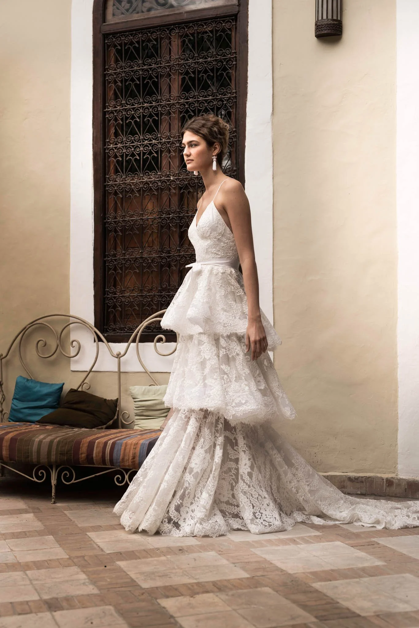 Bride wears wedding dress with layers of french lace "Kate" by Atelier Edwin Oudshoorn