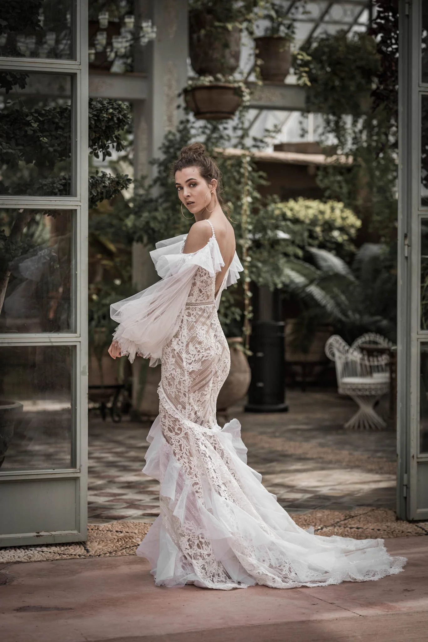 Bride wearing french lace and silk organza fit and flare  wedding gown from  "Ivy" from Atelier Edwin Oudshoorn
