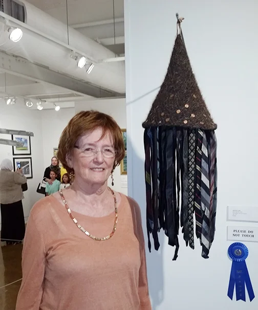 Barbara Cade with Hair Hat #4 won 1st place and a solo exhibit at the Fort Smith Regional Art Museum.