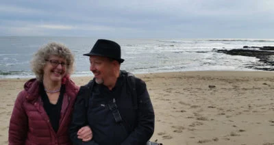 Annette-Cass-on-beach-laughing-400x212.jpg