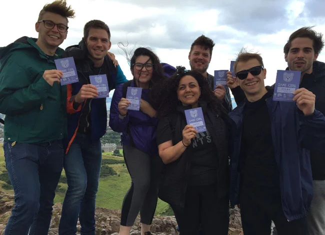 Dani Girl Fringe Team still flyering, even at the top of a mountain.