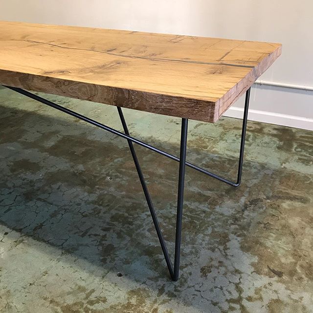 Another picture of the table. This angle gives you a better look at the crossing legwork, which gives great strength for the table, and plenty of human leg room! #livingironsteelworks #customsteelwork #midcenturyfurniture #midcenturytable