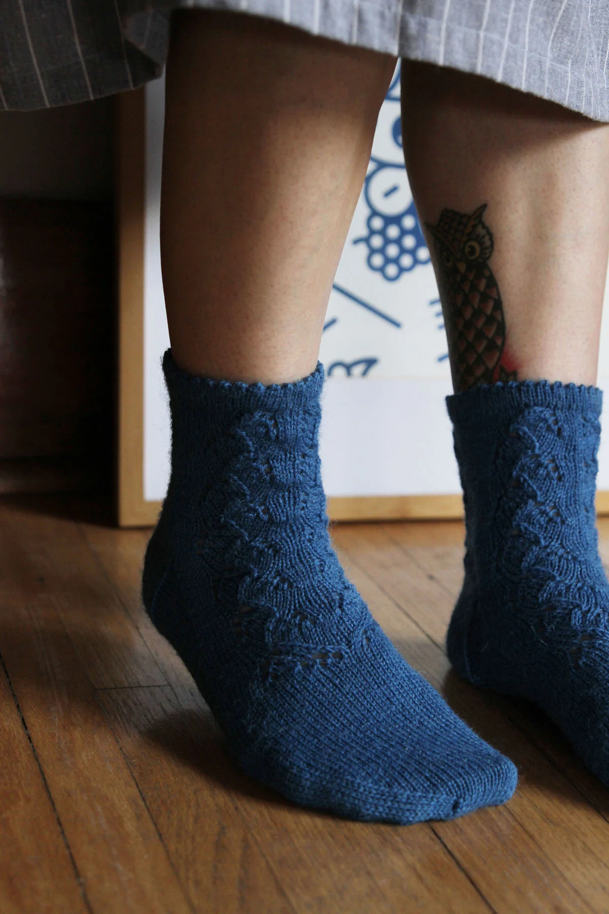 woman standing in front of art wearing osakajo socks.