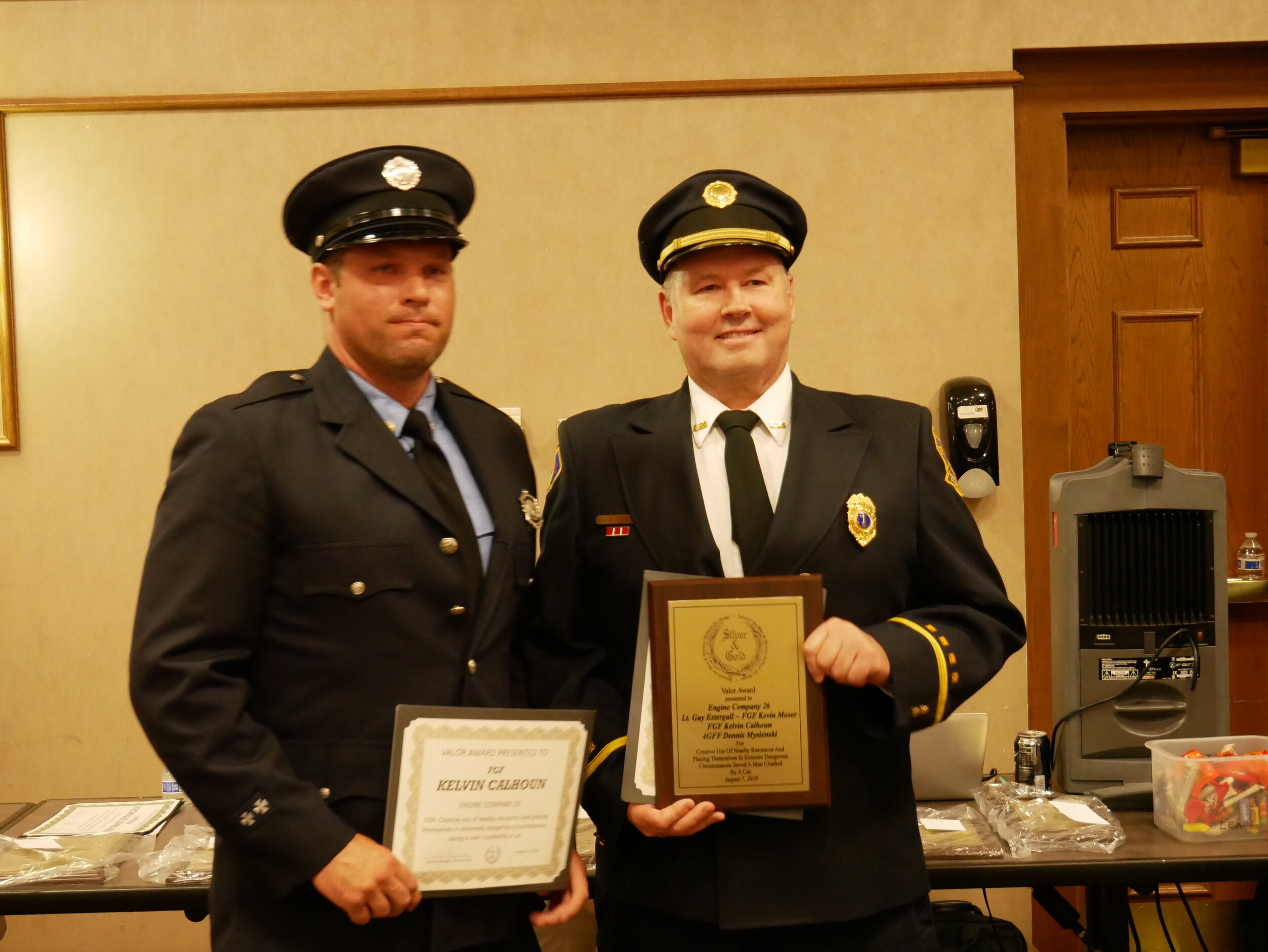  The Valor Award was presented to Engine Company 26 for creative use of nearby resources and placing themselves in extreme dangerous circumstances to save a man crushed by a car. Pictured are FGF Kelvin Calhoun and Lt. Guy Estergall. FGF Kevin Moser 