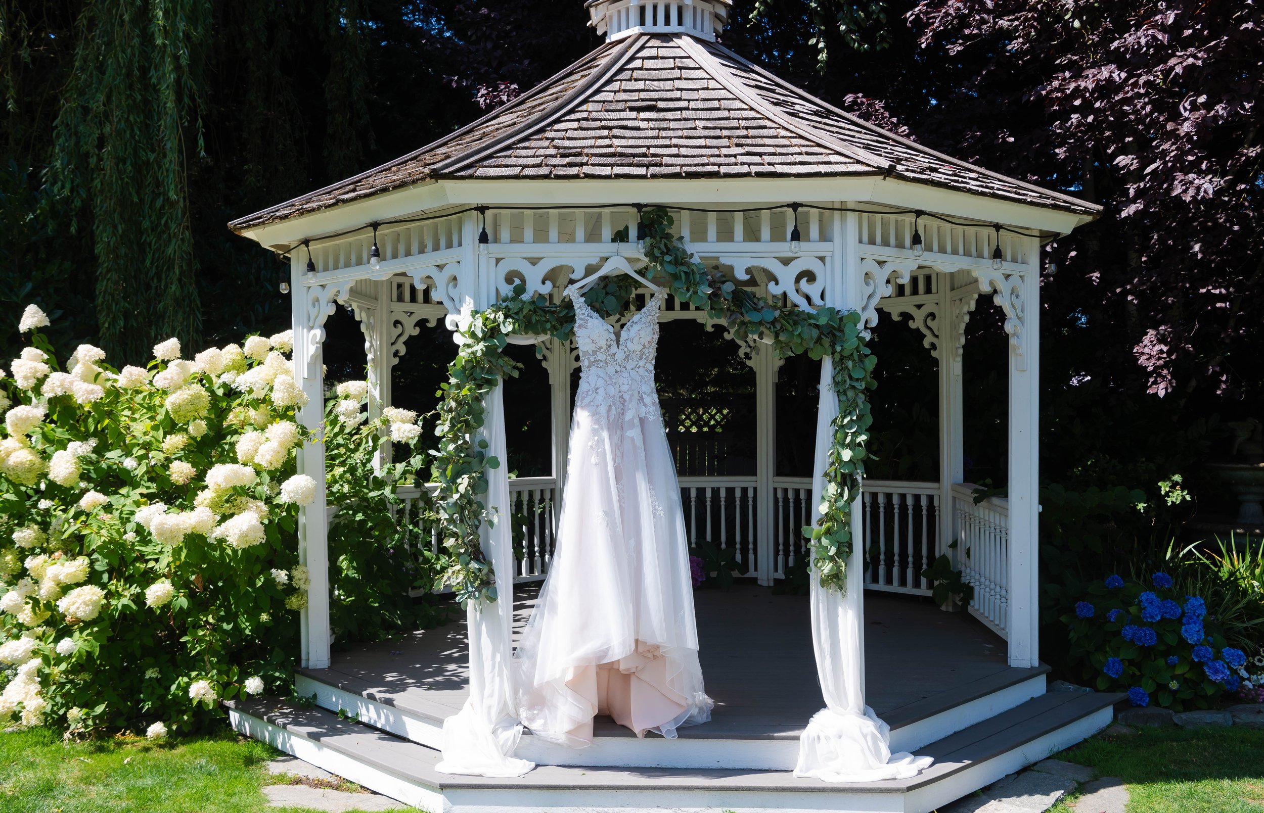  Wedding Gown on Display in front of a gazebo 