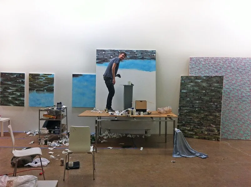 Former artist-in-residence Neil Raitt painting in his GMF studio.