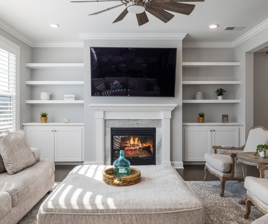 living room with custom built in cabinets and fireplace.png