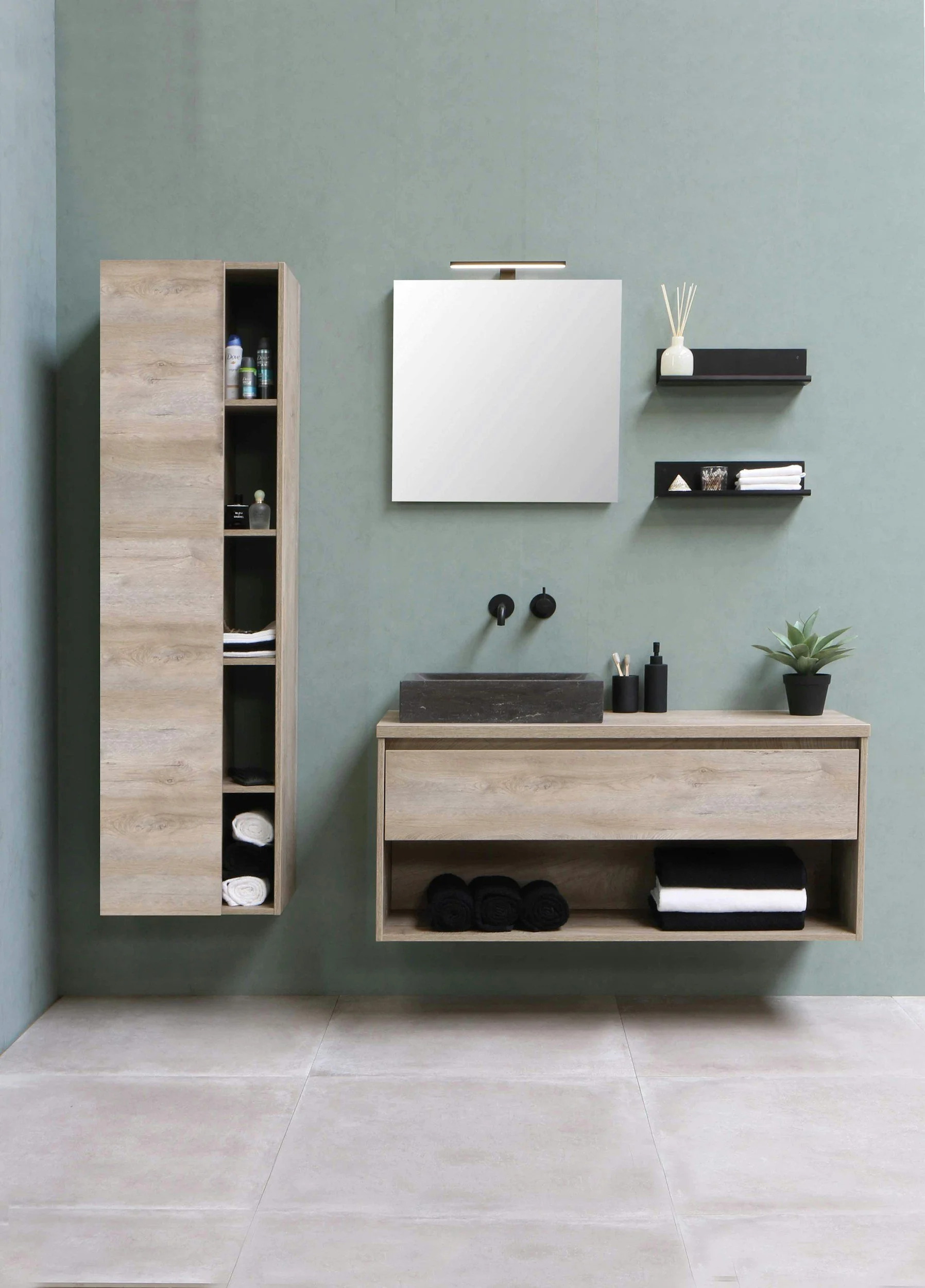Floating vanity with tall vertical storage in a small bathroom, illustrating space-saving design and clean modern styling.