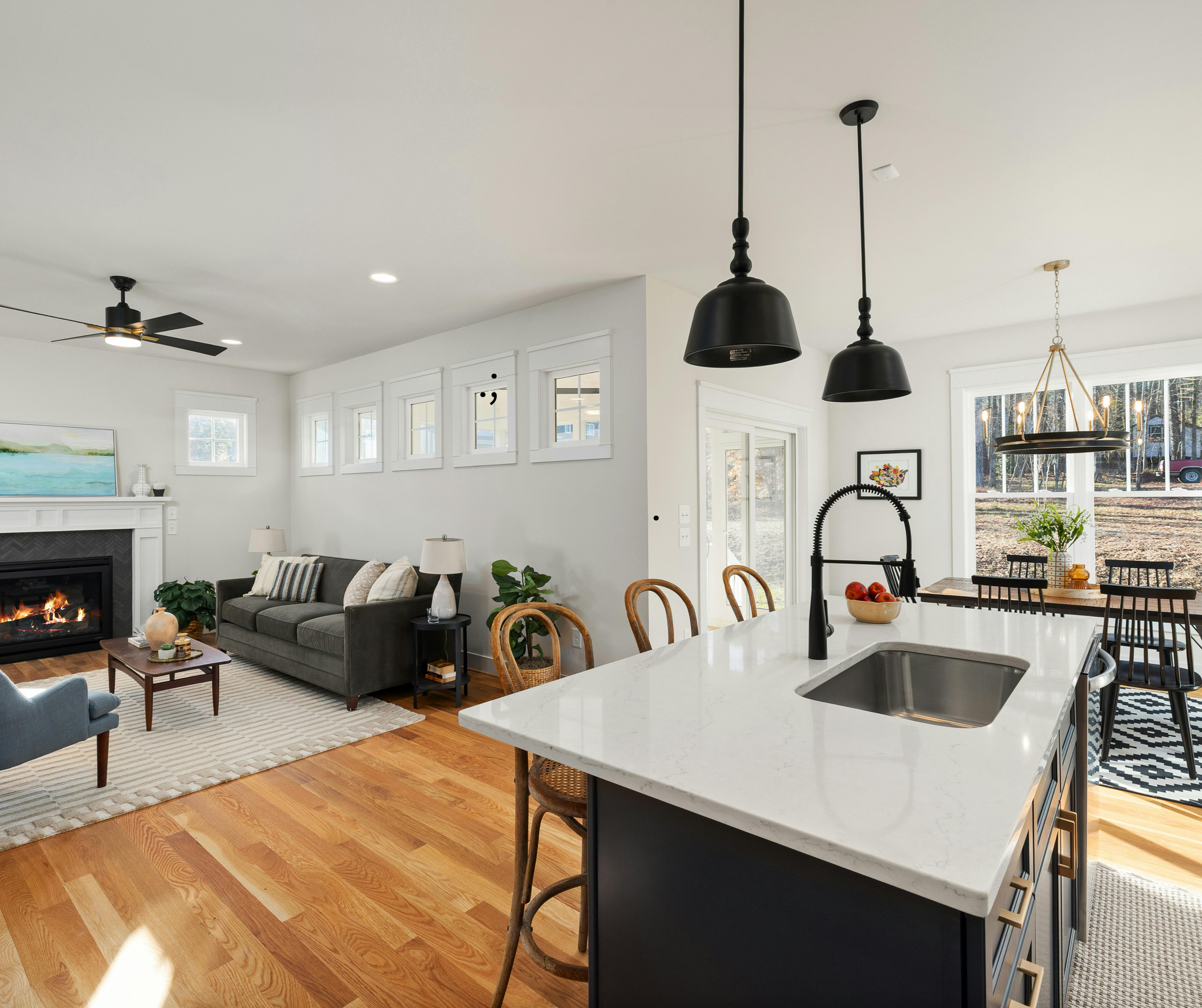 Open-concept kitchen and family room with a large island connecting the two living spaces.