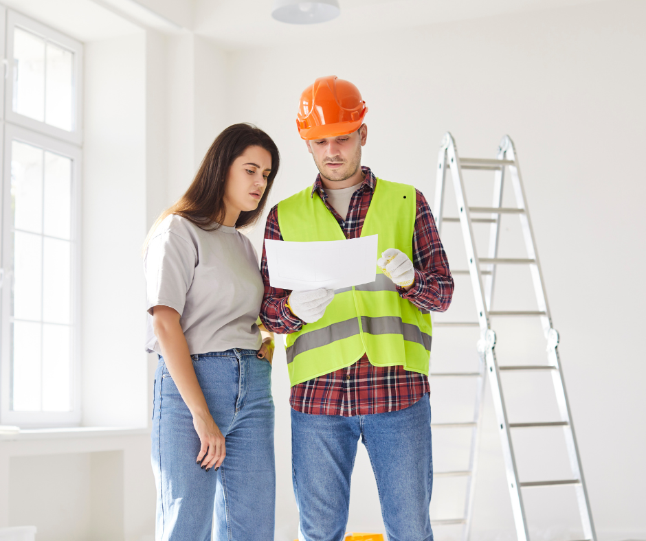Contractor going over some paperwork with a client after finding some issues on a job site.