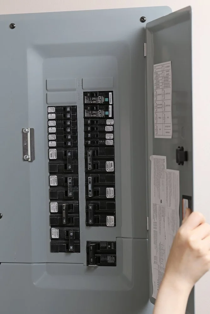 Modern residential electrical panel with circuit breakers, representing a home safety upgrade and electrical improvements often prioritized during renovation planning.