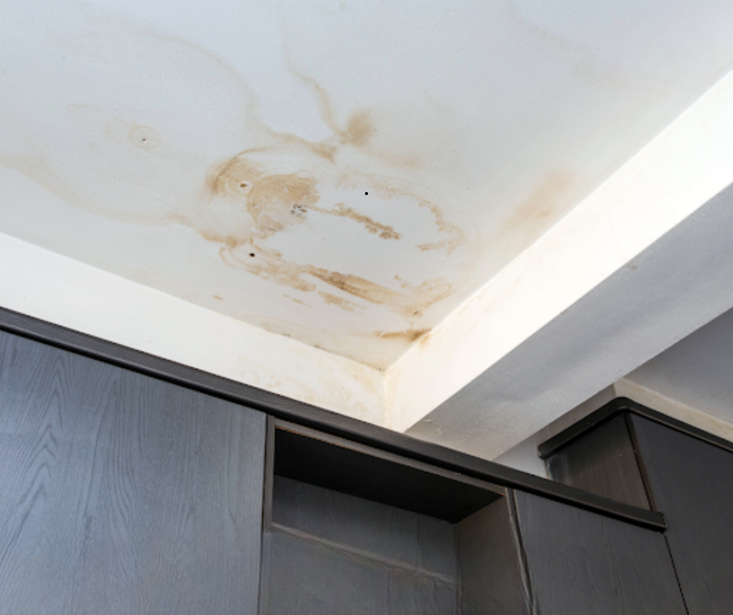 Early ceiling stain showing water damage in a home, a common sign of a hidden leak homeowners should investigate quickly.