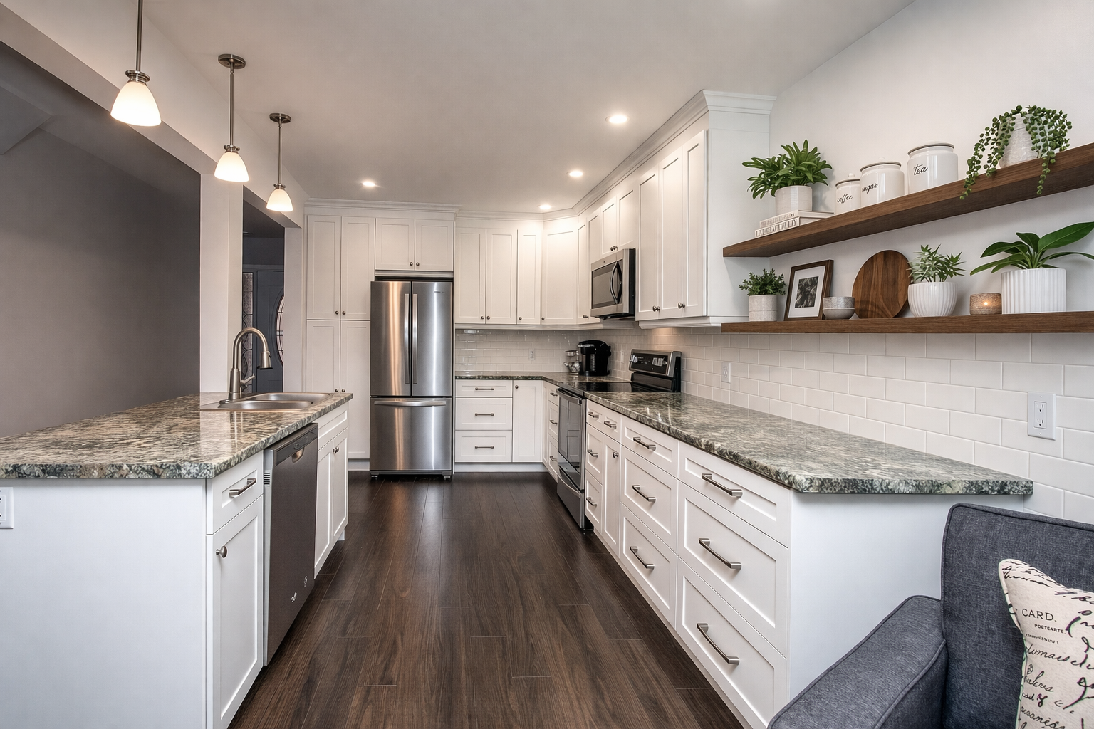 Modern white galley kitchen renovation with shaker cabinets, laminite countertops, subway tile backsplash, stainless steel appliances, and floating wood shelves for added storage and style.