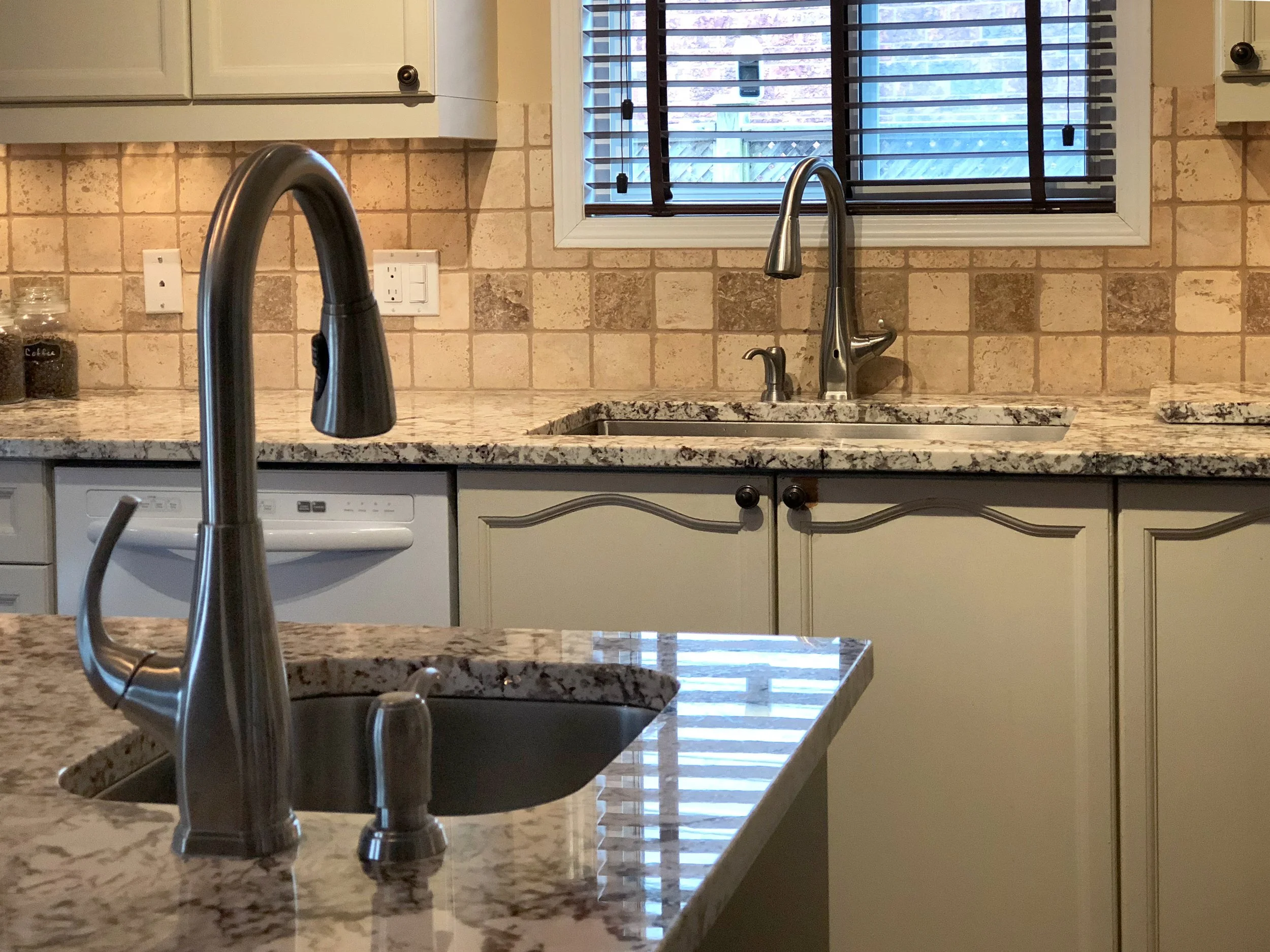 Kitchen island with a dedicated prep sink and separate main sink, creating an efficient prep zone for multiple cooks working in the kitchen.