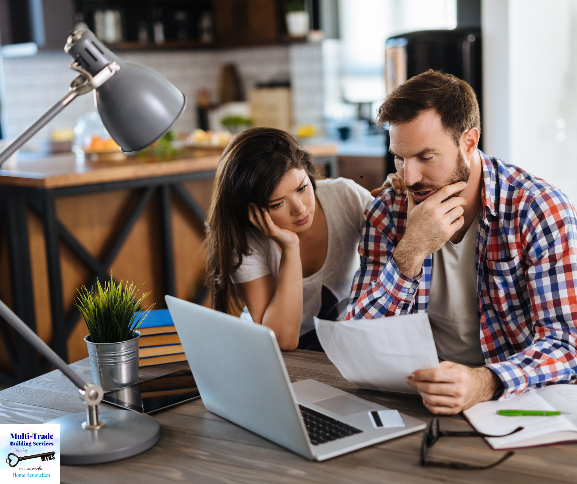 Homeowners comparing renovation contractor quotes at kitchen table